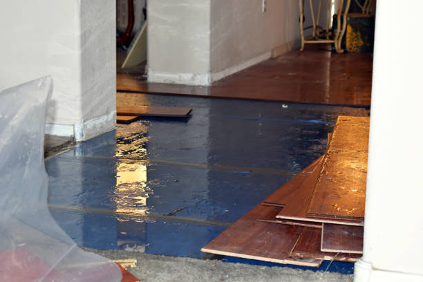 Professional Emergency Water Damage Restoration technician working in Rockaway Park, NY